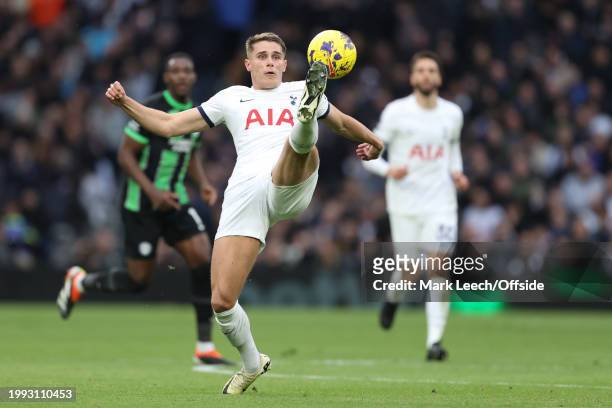 Micky van de Ven of Tottenham Hotspur stretches for the ball during the Premier League match between Tottenham Hotspur and Brighton & Hove Albion at...