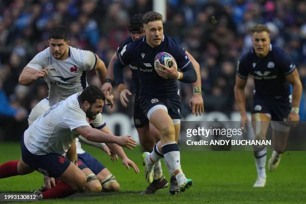 Scotland's wing Kyle Rowe makes a break during the Six Nations international rugby union match between Scotland and France at Murrayfield Stadium in...