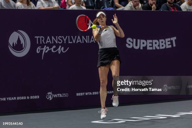 Alize Cornet of France plays the ball in game against Arantxa Rus of Netherlands during WTA250 Transylvania Open on February 7, 2024 in BTarena in...
