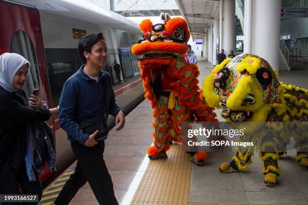 Barongsai Lion dance entertain passengers during Chinese New Year celebration at Padalarang High Speed Train Station in Bandung. PT Kereta Cepat...