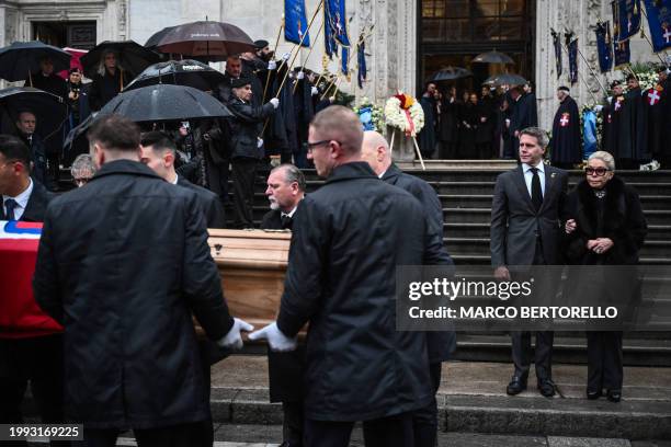Princess Marina Doria of Savoy , widow of Vittorio Emanuele of Savoy, and Prince Emanuele Filiberto of Savoy stand by as pallbearers place the coffin...