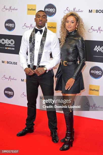 Bugzy Malone and Zol Geraghty attend the MOBO Awards 2024 at Utilita Arena Sheffield on February 07, 2024 in Sheffield, England.