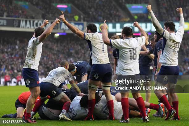 French players celebrate after appearing to have held the ball up in a late attempt at a try for Scotland during the Six Nations international rugby...