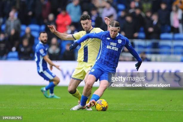Cardiff City's Josh Bowler shields the ball from Preston North End's Andrew Hughes during the Sky Bet Championship match between Cardiff City and...