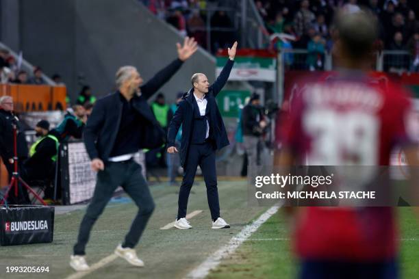 Augsburg's Danish head coach Jess Thorup and Leipzig's German head coach Marco Rose react from the sidelines during the German first division...