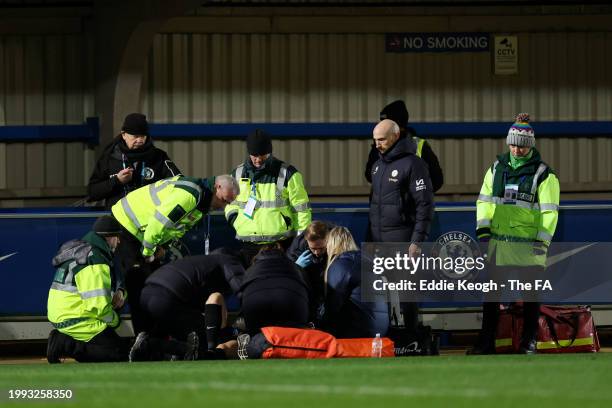 Assistant Referee Ceri Williams receives medical treatment for an injury during the FA Women's Continental Tyres League Cup Quarter Final match...