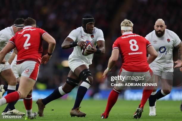 England's lock Maro Itoje makes a break during the Six Nations international rugby union match between England and Wales at Twickenham Stadium in...