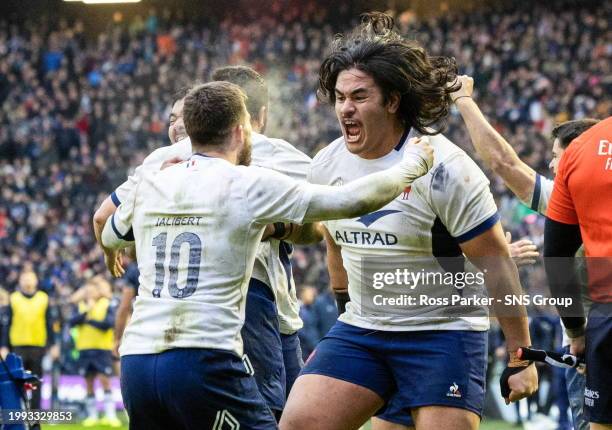 France's Posolo Tuilagi and Matthieu Jalibert celebrate at full time during a Guinness Six Nations match between Scotland and France at Scottish Gas...