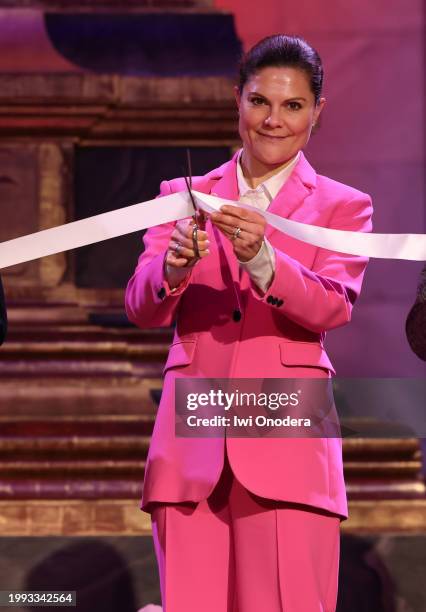 Crown Princess Victoria of Sweden cuts the ribbon at the opening of the exhibition "Nordic Life" at Nordiska Museet on February 07, 2024 in...
