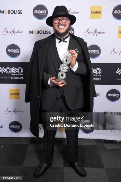 Potter Payper poses with the Album of the Year award in the winners room during the MOBO Awards 2024 at Utilita Arena Sheffield on February 07, 2024...