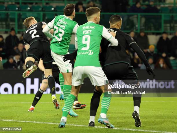 Alastair Johnston of Celtic collides with Nectarios Triantis of Hibernian, leading to Johnston being stretchered off during the Cinch Scottish...