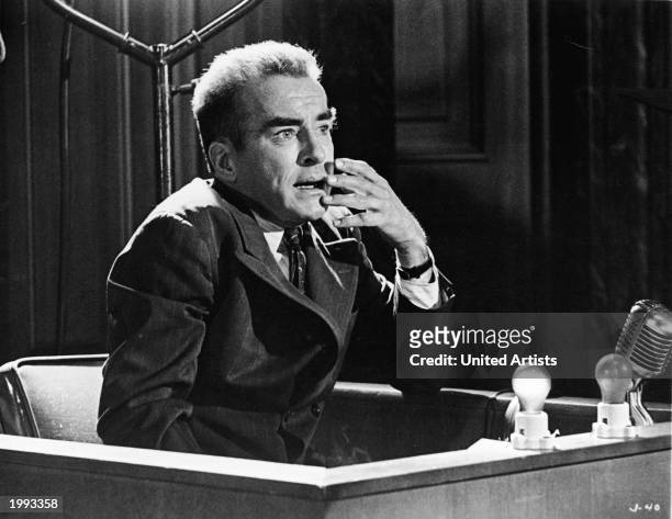 American actor Montgomery Clift as Rudolph Petersen on the witness stand in a still from the film 'Judgment at Nuremberg,' directed by Stanley Kramer...