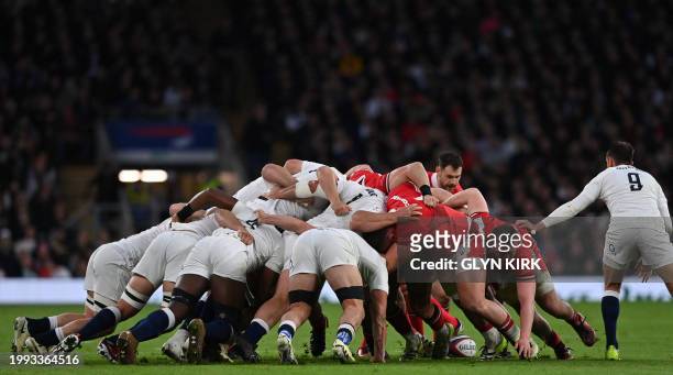 Players compete for the ball in a scrum during the Six Nations international rugby union match between England and Wales at Twickenham Stadium in...