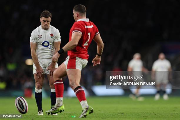 Wales' hooker Elliot Lee kicks the ball off of the stand as ford attempts to take a try conversion stand as during the Six Nations international...