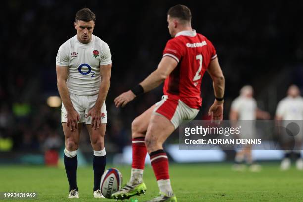 Wales' hooker Elliot Lee kicks the ball off of the stand as ford attempts to take a try conversion stand as during the Six Nations international...