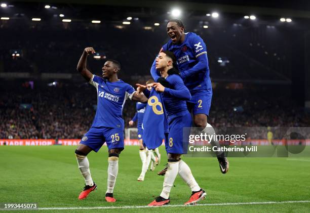 Enzo Fernandez of Chelsea celebrates with Moises Caicedo and Axel Disasi of Chelsea after scoring his team's third goal from a direct free-kick...