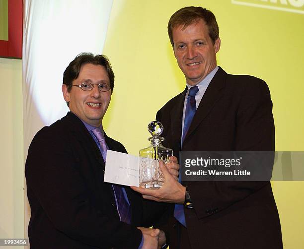 Alistair Campbell , Press Secretary to Prime Minister Tony Blair, presents Jeff Mitchell of Reuters with the award for Nikon Sports Photographer of...