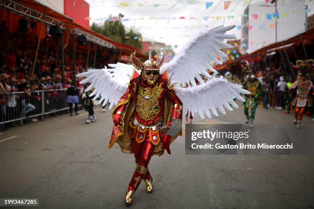 Man wearing traditional clothes dances Diablada dreassed as an angel during the 2024 Oruro Carnival on February 10, 2024 in Oruro, Bolivia. Listed as...