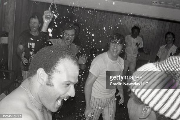 New York Yankee Chris Chambliss gets his first dose of champagne after the game and his game winning home run against the Kansas City Royals to win...