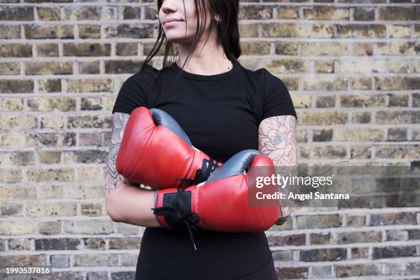 poised female boxer ready for training - youth sports competition stock pictures, royalty-free photos & images