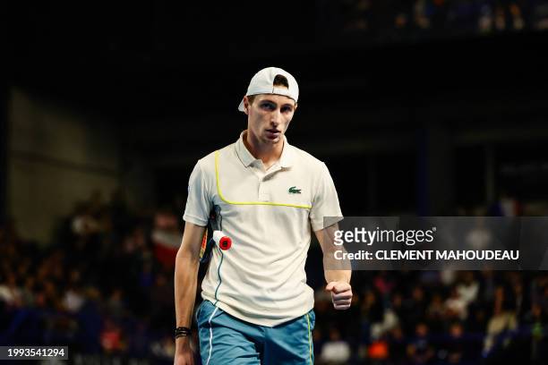 France's Ugo Humbert reacts after winning a point against Poland's Hubert Hurkacz during their men's semi-final singles tennis match at the ATP Open...