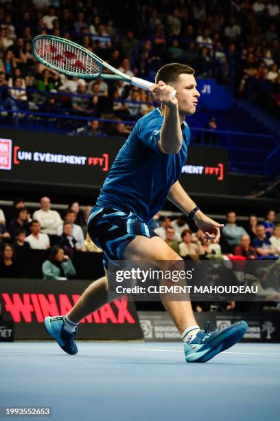 Poland's Hubert Hurkacz plays a forehand shot to France's Ugo Humbert during their men's semi-final singles tennis match at the ATP Open 13 in...