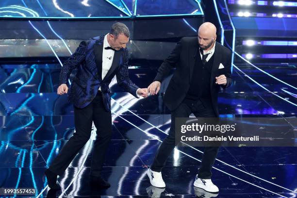 Amadeus and John Travolta attend the 74th Sanremo Music Festival 2024 at Teatro Ariston on February 07, 2024 in Sanremo, Italy.