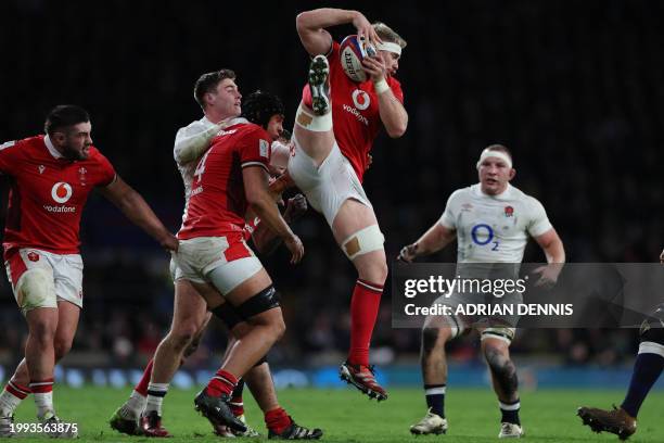 Wales' number 8 Aaron Wainwright jumps to catch the ball during the Six Nations international rugby union match between England and Wales at...