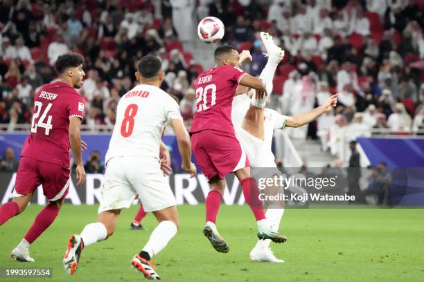 Ahmed Fathi of Qatar goes for a header during the AFC Asian Cup semi-final match between Iran and Qatar at Al Thumama Stadium on February 07, 2024 in...