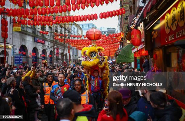 Chinese Lion Dance team perform for spectators during celebrations for Chinese Lunar New Year of the Dragon in central London on February 10, 2024.