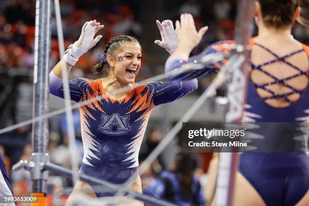 Cassie Stevens of the Auburn Tigers celebrates after competeing on the uneven bars at Neville Arena on February 2, 2024 in Auburn, Alabama.