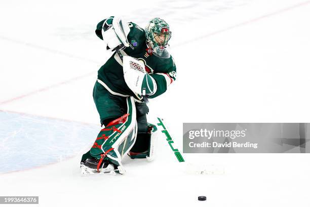 Marc-Andre Fleury of the Minnesota Wild passes the puck against the Calgary Flames in the third period at Xcel Energy Center on January 02, 2024 in...