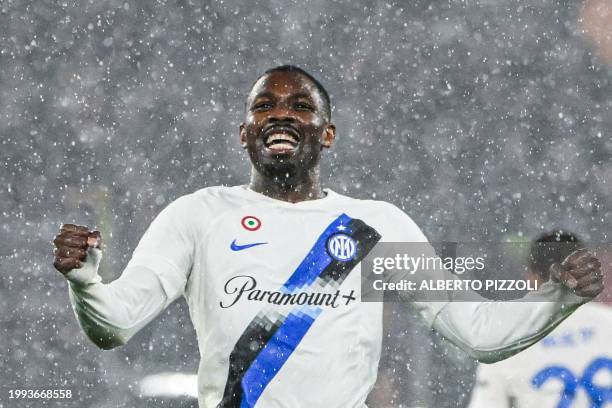 Inter Milan's French forward Marcus Thuram celebrates after AS Roma scored an own goal during the Italian Serie A football match between AS Roma and...