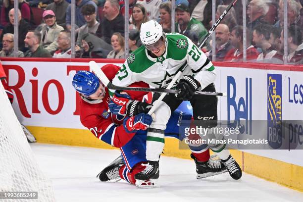 Arber Xhekaj of the Montreal Canadiens and Mason Marchment of the Dallas Stars battle against each other during the first period at the Bell Centre...
