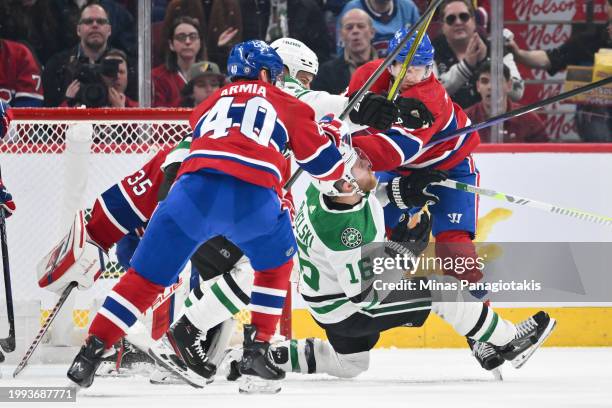 Joe Pavelski of the Dallas Stars is caught between Joel Armia and Mike Matheson of the Montreal Canadiens during the second period at the Bell Centre...