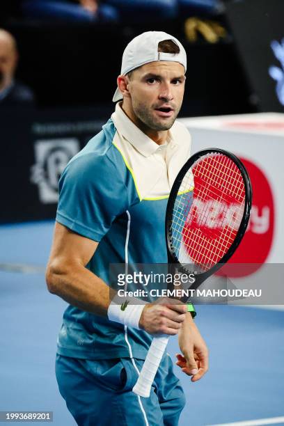Bulgaria's Grigor Dimitrov reacts after a point against Russia's Karen Khachanov during their men's semi-final singles tennis match at the ATP Open...