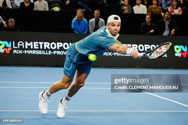 Bulgaria's Grigor Dimitrov stretches for a return to Russia's Karen Khachanov during their men's semi-final singles tennis match at the ATP Open 13...