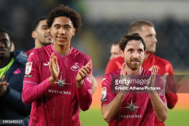 Bashir Humphreys and Joe Allen of Swansea City applaud away fans after the game during the Sky Bet Championship match between Hull City and Swansea...