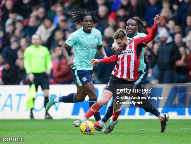 Lincoln City's Ted Bishop is fouled by Fleetwood Town's Bosun Lawal during the Sky Bet League One match between Lincoln City and Fleetwood Town at...