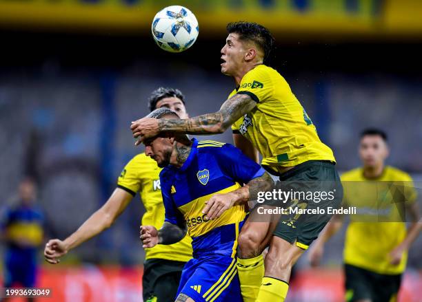 Santiago Ramos Mingo of Defensa y Justicia heads the ball against Dario Benedetto of Boca Juniors during a Copa de la Liga 2024 group B match between...