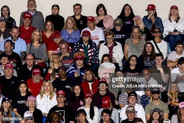 People attend a "Get Out the Vote" Rally for former US President and 2024 presidential hopeful Donald Trump in Conway, South Carolina, on February...