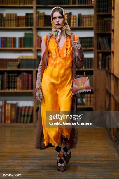 Model on the runway at Anna Sui RTW Fall 2024 as part of New York Ready to Wear Fashion Week held at the Strand Book Store on February 10, 2024 in...