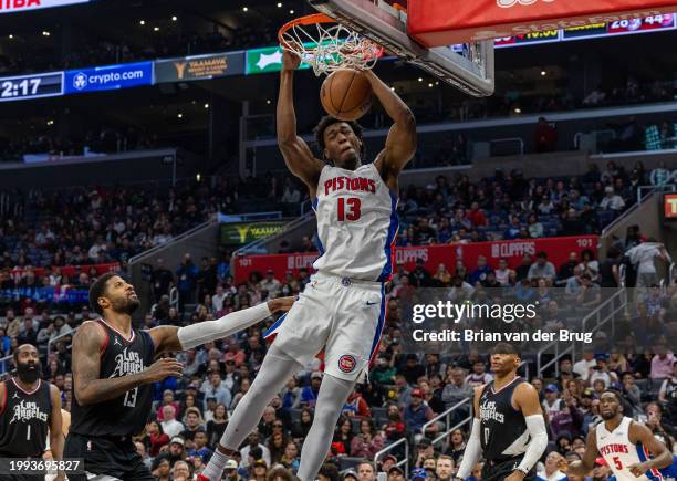 Los Angeles, CA Pistons James Wiseman, no. 13, center, dunks as Clippers Russell Westbrook, no. 0, right, and Clippers Paul George, no. 13, look on...