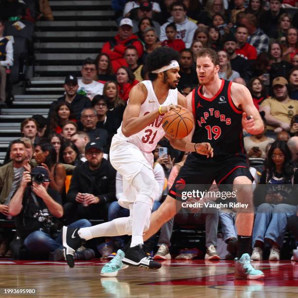 Jarrett Allen of the Cleveland Cavaliers dribbles the ball during the game against the Toronto Raptors on February 10, 2024 at the Scotiabank Arena...