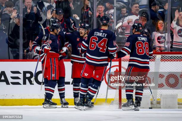 Nino Niederreiter, Adam Lowry, Mason Appleton, Logan Stanley and Nate Schmidt of the Winnipeg Jets celebrate a first period goal against the...