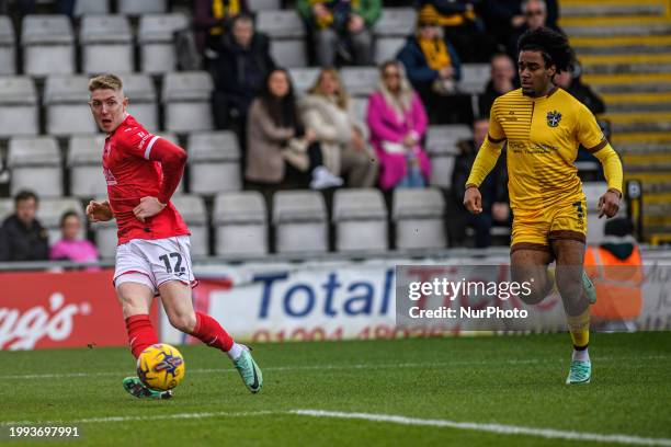 Joel Senior of Morecambe is crossing the ball, leading to a goal for Morecambe, during the Sky Bet League 2 match between Morecambe and Sutton United...