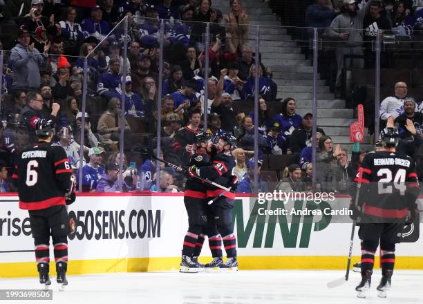 Vladimir Tarasenko of the Ottawa Senators celebrates his second period goal against the Toronto Maple Leafs with teammates Shane Pinto, Jakob...