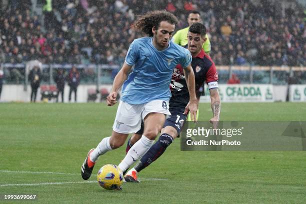 Matteo Guendouzi of SS Lazio and Alessandro Deiola, wearing number 14 for Cagliari Calcio, are competing during the Serie A TIM match between...