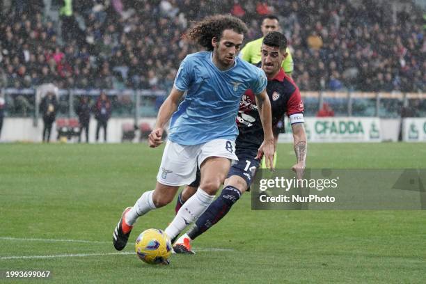 Matteo Guendouzi of SS Lazio and Alessandro Deiola, wearing number 14 for Cagliari Calcio, are competing during the Serie A TIM match between...