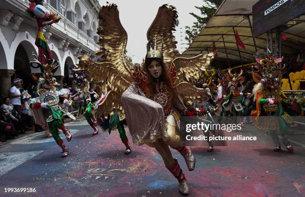 February 2024, Bolivia, Oruro: Dancers from the "Diablada" group perform during the Oruro Carnival in Oruro. The festival with folk dances, costumes...